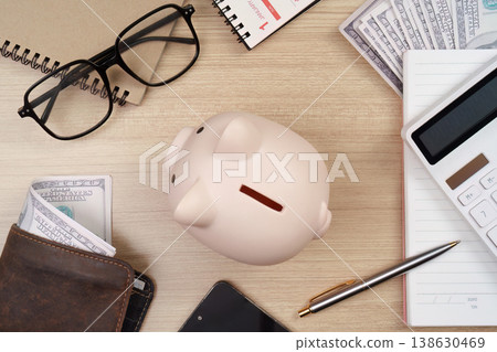 Overhead view of financial tools and piggy bank Overhead view of financial tools and piggy bank 138630469