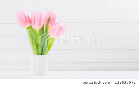 Fresh Pink Tulips in White Ceramic Vase on Light Background Fresh Pink Tulips in White Ceramic Vase on Light Background 138630672