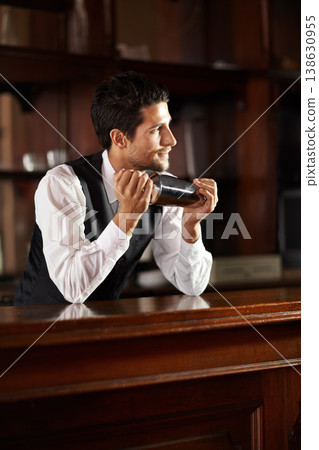 Shake, mixer and bartender with a cocktail, drink or chat with customer in dark club at night. Mixing, alcohol and face of barman with vodka or liquor in metal container for a strong beverage in bar Shake, mixer and bartender with a cocktail, drink or chat with customer in dark club at night. Mixing, alcohol and face of barman with vodka or liquor in metal container for a strong beverage in bar 138630955