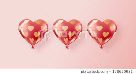 Three red and pink helium balloons in a pattern of golden hearts. 138630981