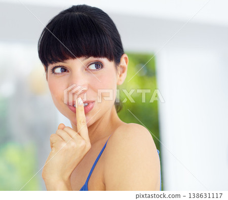Secret, gossip and young woman at her home with finger on her mouth in her modern home. Whisper, silence hand gesture and female person from Canada with a quiet or hush facial expression in her house 138631117