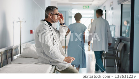 Depression, grief or fail with a mature doctor in a hospital looking unhappy for healthcare or medical. Stress, mistake or loss with a sad man medicine professional in a professional medicare clinic Depression, grief or fail with a mature doctor in a hospital looking unhappy for healthcare or medical. Stress, mistake or loss with a sad man medicine professional in a professional medicare clinic 138631229
