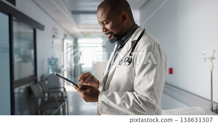 Doctor, hospital and tablet of healthcare information, typing and management of online charts or results. Healthcare worker or african person smile for service, planning or data on digital technology 138631307