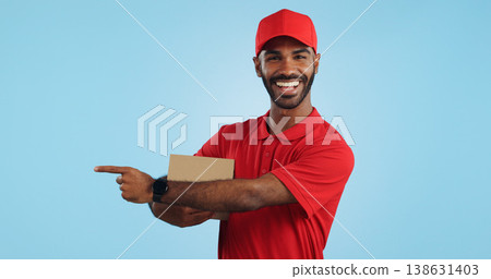 Advertising studio smile, delivery man and point at supply chain commercial, discount export info or distribution schedule. Courier service deal, mockup space and portrait person on blue background Advertising studio smile, delivery man and point at supply chain commercial, discount export info or distribution schedule. Courier service deal, mockup space and portrait person on blue background 138631403
