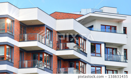 Apartments in residential complex. Housing structure at modern house. Architecture for property investment. and architecture details. Urban abstract - windows of apartment building. Apartments in residential complex. Housing structure at modern house. Architecture for property investment. and architecture details. Urban abstract - windows of apartment building. 138631435