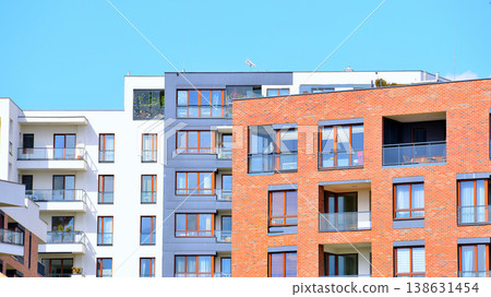 Apartments in residential complex. Housing structure at modern house. Architecture for property investment. and architecture details. Urban abstract - windows of apartment building. Apartments in residential complex. Housing structure at modern house. Architecture for property investment. and architecture details. Urban abstract - windows of apartment building. 138631454