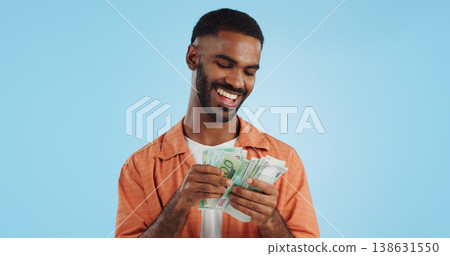 Man, count cash and happy in studio with success, bonus or promotion with winning by blue background. Investor, trader or person with Euro money, salary or savings with smile for financial freedom go Man, count cash and happy in studio with success, bonus or promotion with winning by blue background. Investor, trader or person with Euro money, salary or savings with smile for financial freedom go 138631550