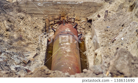 Sewerage.Dug hole with metal water sewer pipes for repair,replacement Sewerage.Dug hole with metal water sewer pipes for repair,replacement 138631690