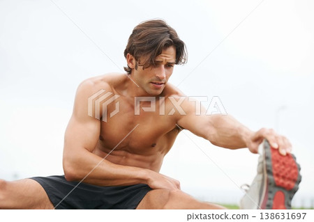 Fitness, warm up and man on grass for workout, summer sports and wellness in outdoor training. Exercise, stretching legs and shirtless athlete on lawn for health, muscle and body care commitment. 138631697