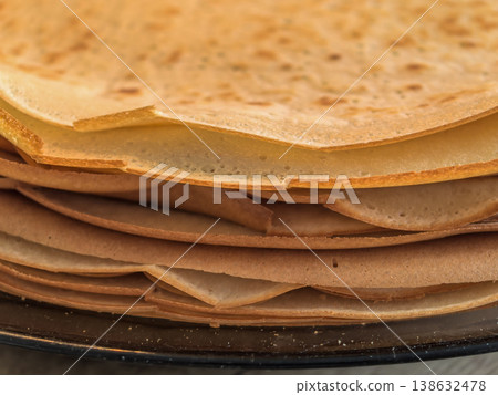 Macro Texture of a Stack of Freshly Cooked Thin Pancakes Macro Texture of a Stack of Freshly Cooked Thin Pancakes 138632478