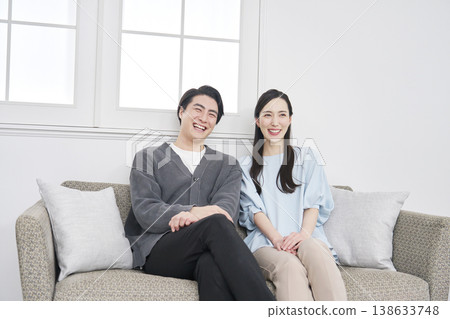 Portrait of a middle-aged couple in their living room. Portrait of a middle-aged couple in their living room. 138633748