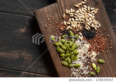 Mix of seeds on wooden board Mix of seeds on wooden board 138634047