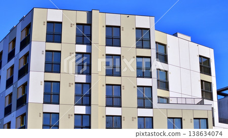 Apartments in residential complex. Housing structure at modern house. Architecture for property investment. and architecture details. Urban abstract - windows of apartment building. Apartments in residential complex. Housing structure at modern house. Architecture for property investment. and architecture details. Urban abstract - windows of apartment building. 138634074