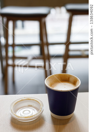 Cup of hot milk latte coffee on table by the window. Cup of hot milk latte coffee on table by the window. 138634092