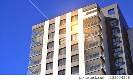 Exterior of a high modern multi-story apartment building - facade, windows and balconies. 138634168