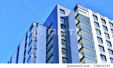 Exterior of a high modern multi-story apartment building - facade, windows and balconies. Exterior of a high modern multi-story apartment building - facade, windows and balconies. 138634197