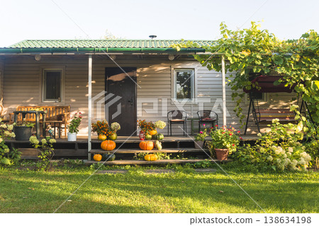 Garden house with terrace on sunny autumn day Garden house with terrace on sunny autumn day 138634198