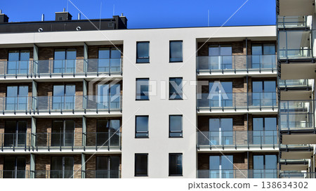 Apartments in residential complex. Housing structure at modern house. Architecture for property investment. and architecture details. Urban abstract - windows of apartment building. Apartments in residential complex. Housing structure at modern house. Architecture for property investment. and architecture details. Urban abstract - windows of apartment building. 138634302
