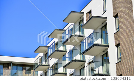 Apartments in residential complex. Housing structure at modern house.  Architecture for property investment. and architecture details. Urban abstract - windows of apartment building. 138634311