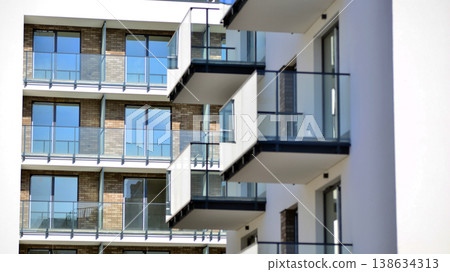 Apartments in residential complex. Housing structure at modern house.  Architecture for property investment. and architecture details. Urban abstract - windows of apartment building. 138634313