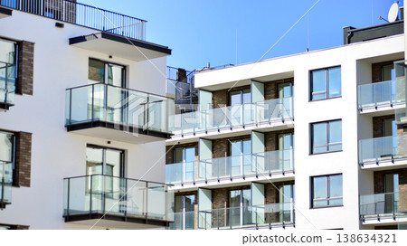 Apartments in residential complex. Housing structure at modern house. Architecture for property investment. and architecture details. Urban abstract - windows of apartment building. Apartments in residential complex. Housing structure at modern house. Architecture for property investment. and architecture details. Urban abstract - windows of apartment building. 138634321