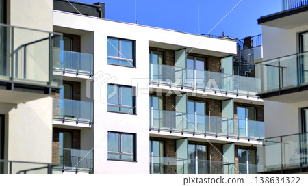 Apartments in residential complex. Housing structure at modern house.  Architecture for property investment. and architecture details. Urban abstract - windows of apartment building. 138634322