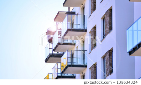 Apartments in residential complex. Housing structure at modern house. Architecture for property investment. and architecture details. Urban abstract - windows of apartment building. Apartments in residential complex. Housing structure at modern house. Architecture for property investment. and architecture details. Urban abstract - windows of apartment building. 138634324