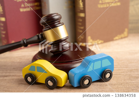 Car accident lawsuit and insurance, Judge hammer with car model. Car accident lawsuit and insurance, Judge hammer with car model. 138634358