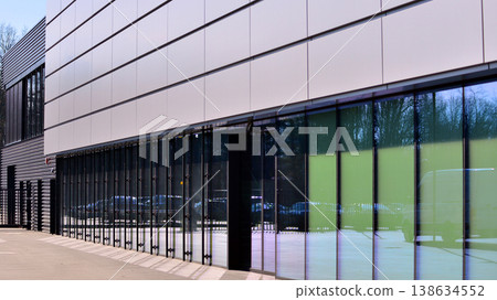 Empty new constructed automobile dealership. The building contains a sales room, offices, service and parts warehouse.  138634552