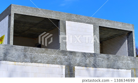 Single family house construction site. Modern designed single-family house under construction. Single family house construction site. Modern designed single-family house under construction. 138634699