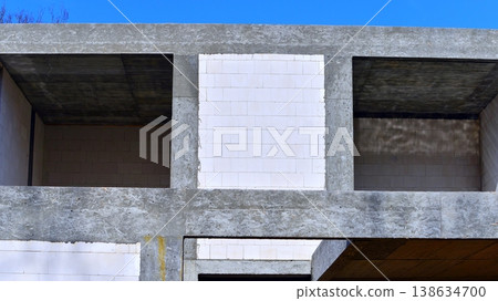 Single family house construction site. Modern designed single-family house under construction. Single family house construction site. Modern designed single-family house under construction. 138634700