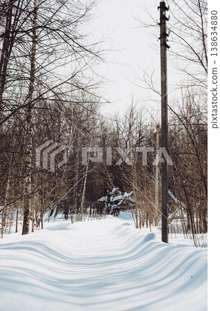 Beautiful winter landscape, country road and trees covered with snow. Winter nature background. Vertical photo. Beautiful winter landscape, country road and trees covered with snow. Winter nature background. Vertical photo. 138634880