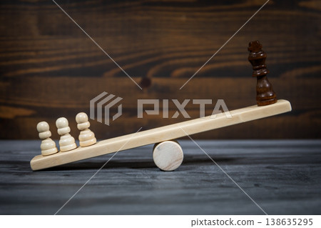 Popular Opinion Outweighing Elite Power Shown By Chess Figures On Seesaw Popular Opinion Outweighing Elite Power Shown By Chess Figures On Seesaw 138635295