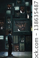 Businessman facing wall of screens with different versions of himself emotions. 138635487