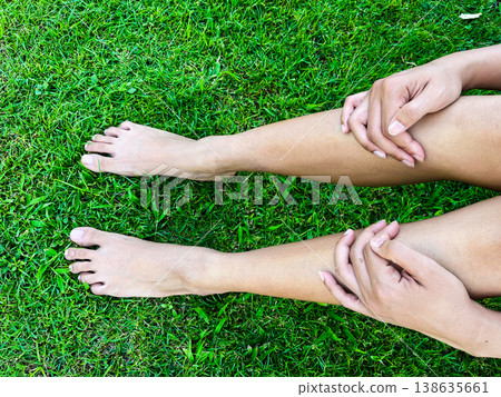 barefoot relaxing on fresh green grass in morning light, symbolizing grounding, natural healing, wellness lifestyle, mindfulness, calmness, and peaceful connection with nature barefoot relaxing on fresh green grass in morning light, symbolizing grounding, natural healing, wellness lifestyle, mindfulness, calmness, and peaceful connection with nature 138635661