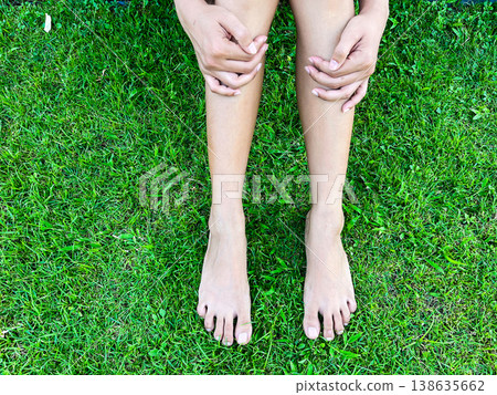 barefoot relaxing on fresh green grass in morning light, symbolizing grounding, natural healing, wellness lifestyle, mindfulness, calmness, and peaceful connection with nature barefoot relaxing on fresh green grass in morning light, symbolizing grounding, natural healing, wellness lifestyle, mindfulness, calmness, and peaceful connection with nature 138635662