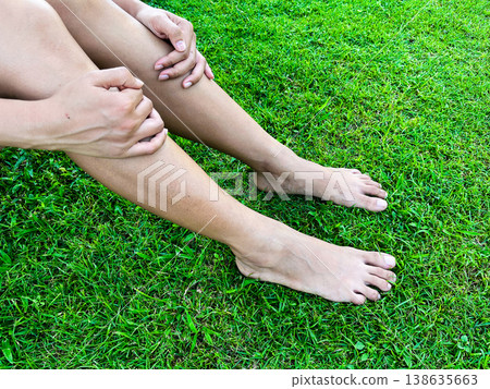 barefoot relaxing on fresh green grass in morning light, symbolizing grounding, natural healing, wellness lifestyle, mindfulness, calmness, and peaceful connection with nature barefoot relaxing on fresh green grass in morning light, symbolizing grounding, natural healing, wellness lifestyle, mindfulness, calmness, and peaceful connection with nature 138635663
