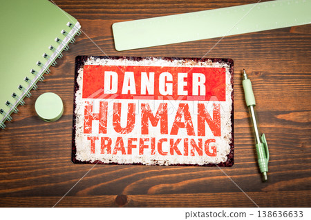Human Trafficking Warning Message Displayed On Distressed Metal Sign 138636633