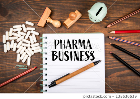 PHARMA BUSINESS Notebook With Capsules Stamps And Stationery On Desk PHARMA BUSINESS Notebook With Capsules Stamps And Stationery On Desk 138636639