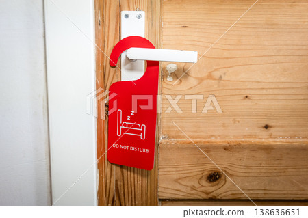 Privacy Notice Hanging On Wooden Door Handle With DO NOT DISTURB Sign Privacy Notice Hanging On Wooden Door Handle With DO NOT DISTURB Sign 138636651