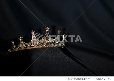 Golden Crown with Citrine Gemstones on Black Background. Luxury Royal Concept. Golden Crown with Citrine Gemstones on Black Background. Luxury Royal Concept. 138637250