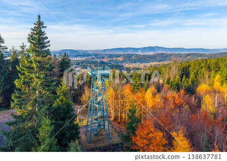 Explore the Slovanka Lookout Tower nestled in the Jizera Mountains. Surrounded by vibrant autumn foliage, this historic iron tower offers stunning views of the landscape. Explore the Slovanka Lookout Tower nestled in the Jizera Mountains. Surrounded by vibrant autumn foliage, this historic iron tower offers stunning views of the landscape. 138637781
