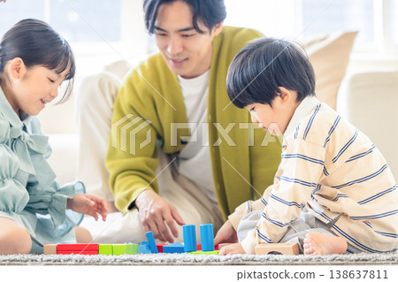 A family relaxing in the living room 138637811