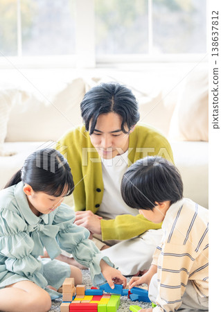 Families playing in the living room Families playing in the living room 138637812
