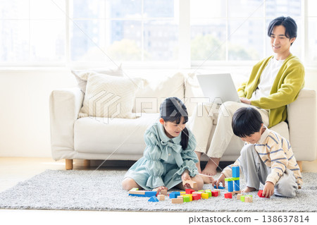 A family relaxing in the living room A family relaxing in the living room 138637814