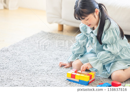 Children playing with building blocks Children playing with building blocks 138637816