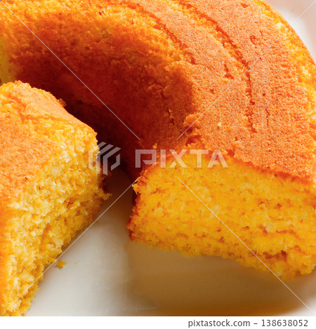 Corn Cake With Coconut white plate on rustic wooden table. Typical Brazilian party food. 138638052