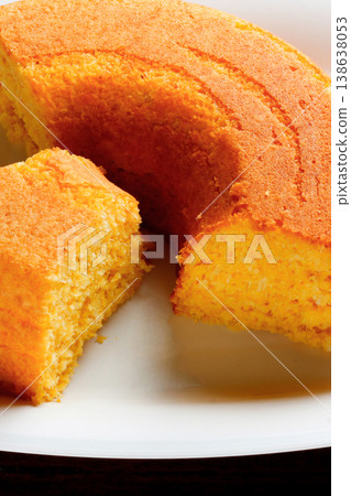 Corn Cake With Coconut white plate on rustic wooden table. Typical Brazilian party food. Corn Cake With Coconut white plate on rustic wooden table. Typical Brazilian party food. 138638053
