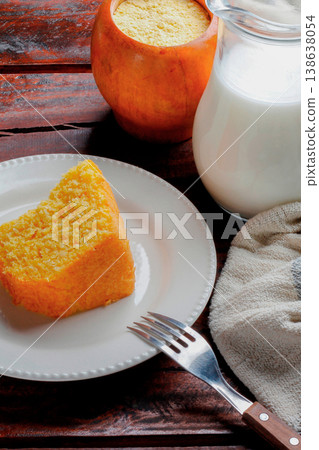Corn Cake With Coconut white plate on rustic wooden table. Typical Brazilian party food. 138638054