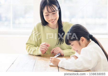 Parents and children studying in the living room Parents and children studying in the living room 138638093